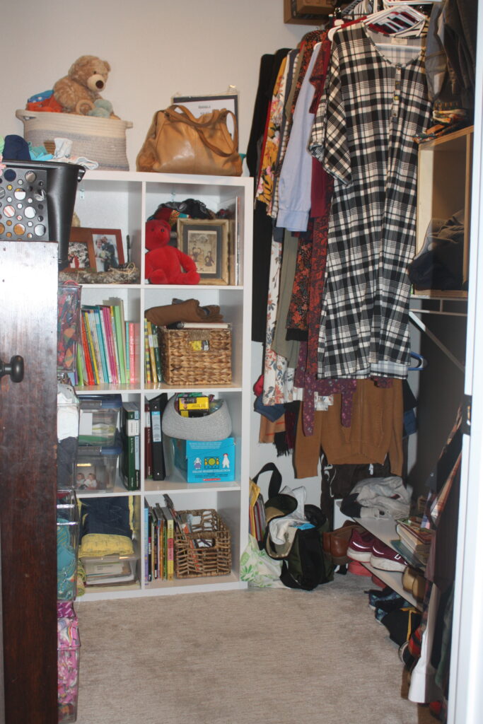 Clothes in walk-in closet. Laundry hacks for families.