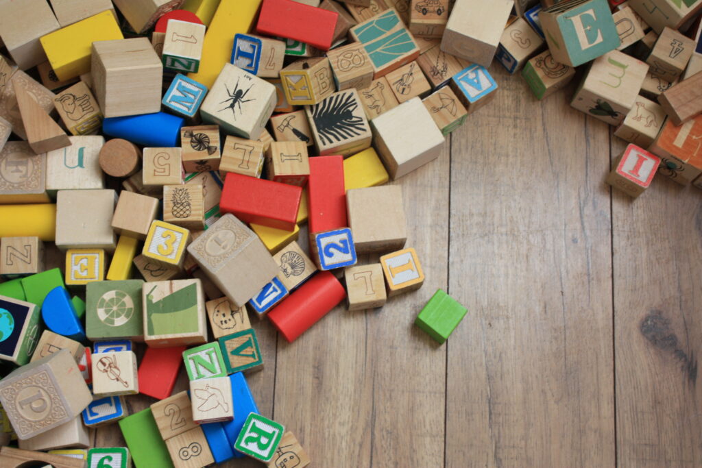 decluttering toys, wooden blocks on the floor