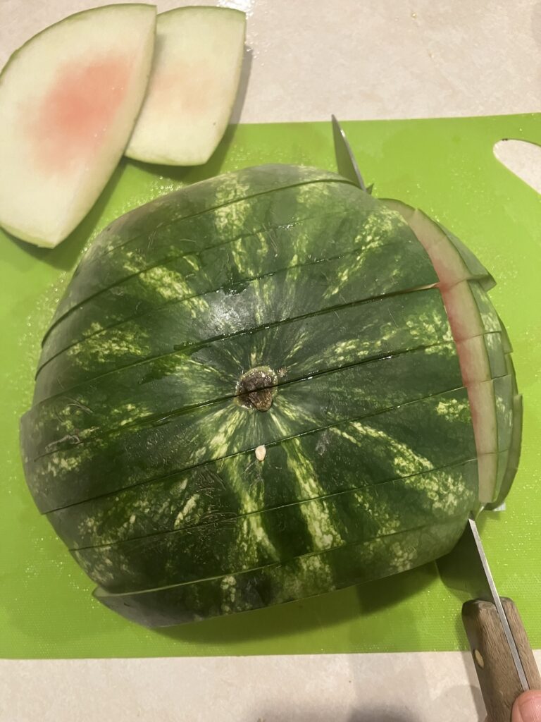 slicing watermelon into sticks